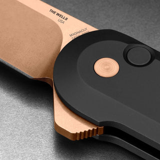 James The Wells Knife showing titanium handle and copper pivot detail close-up