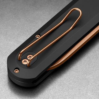 James The Wells Knife close-up showing black aluminum handle with copper clip and screws by The James Brand