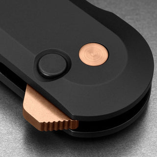 James The Wells Knife showing matte black handle with copper button and thumb stud by The James Brand
