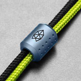 James The Alder Lanyard & Bead anodized blue aluminum bead with black and green nylon paracord strands