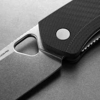 Close-up of James The Folsom Pro Knife showing textured black G10 handle and stonewashed LC200N steel blade