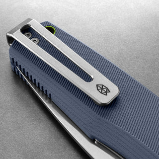 Close-up of James The Folsom Pro Knife clip and textured blue G10 handle by The James Brand