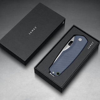 James The Folsom Pro Knife with blue G10 handle displayed in sleek black James Brand packaging