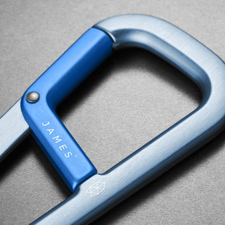 James The Hardin Carabiner in anodized blue aluminum with spring-loaded dual compartment latch close-up