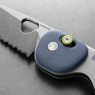 James The Redstone Knife with textured blue polypropylene handle and serrated stainless steel blade close-up