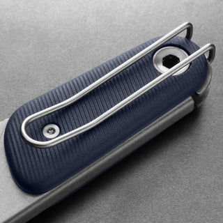 James The Redstone Knife showing textured navy polypropylene handle with stainless steel pocket clip close-up