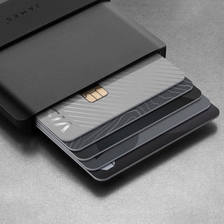 James The Lowe Wallet sliding open to reveal multiple sleek cards in a black aluminum casing