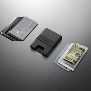 James The Lowe Wallet by The James Brand in black aluminum with silicone band holding cards and cash