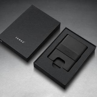 James The Lowe Wallet in black aluminum with silicone band shown inside premium black packaging by The James Brand