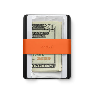 James The Lowe Wallet with black aluminum frame and bright orange silicone band holding cash and cards
