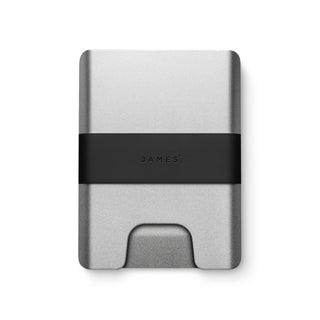 James The Lowe Wallet with sleek silver aluminum body and black silicone band by The James Brand