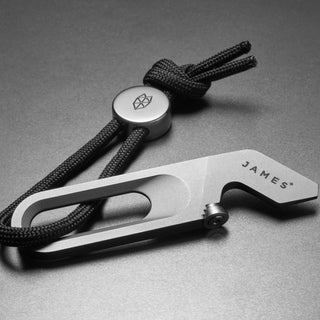 James The Halifax Multitool in titanium with black paracord and polished metal bead by The James Brand