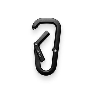 James The Hardin Carabiner in black anodized aluminum with spring-loaded latch and dual compartment design