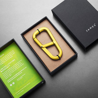 James The Hardin Carabiner in anodized gold aluminum inside black James Brand gift box