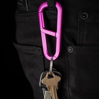 James The Hardin Carabiner in anodized purple aluminum clipped to black pants with keys attached