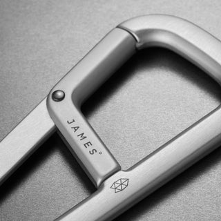 James The Hardin Carabiner in anodized aluminum showing close-up of spring latch and brushed texture