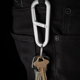 James The Hardin Carabiner in anodized aluminum holding keys clipped to black fabric loop