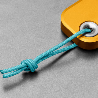 James The Palmer Knife with anodized orange aluminum handle and blue braided cord loop detail