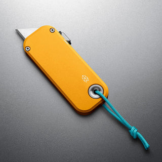 James The Palmer Knife with anodized yellow aluminum handle and extended high carbon steel blade