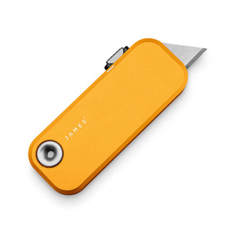James The Palmer Knife in anodized orange aluminum with silver high carbon steel utility blade extended
