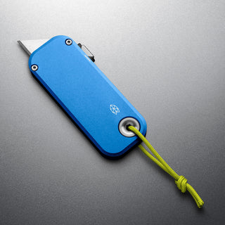 James The Palmer Knife with anodized blue aluminum handle and exposed stainless blade tip