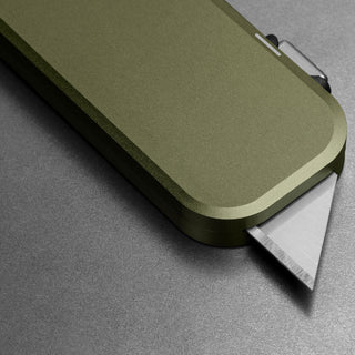 James The Palmer Knife with anodized olive aluminum handle and exposed high carbon steel blade edge