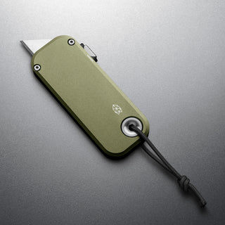 James The Palmer Knife by The James Brand with green anodized aluminum handle and exposed blade angle