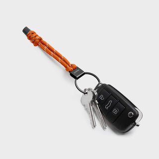 Orbitkey Urban Loop Keychain with orange polyester paracord and attached keys and car remote fob