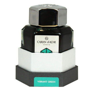 Caran d'Ache Fountain Pen Ink Bottle 50 ml in vibrant green with hexagonal glass design and metallic cap