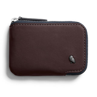 Bellroy Card Pocket in dark brown leather with zipper closure and embossed owl logo detail