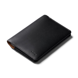 Bellroy Passport Cover in black leather with subtle embossed logo and fine contrast stitching detail