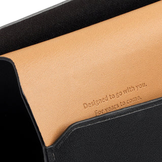 Bellroy Passport Cover showing smooth tan leather interior with embossed motivational text detail