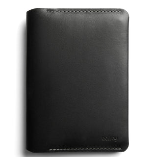 Bellroy Passport Cover in black leather with smooth texture and subtle embossed logo on front