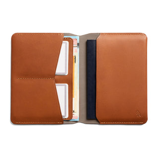 Bellroy Passport Cover in tan leather open showing multiple compartments and card slots