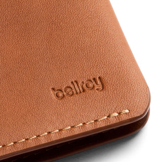 Bellroy Passport Cover in tan leather with textured finish and detailed stitching close-up view