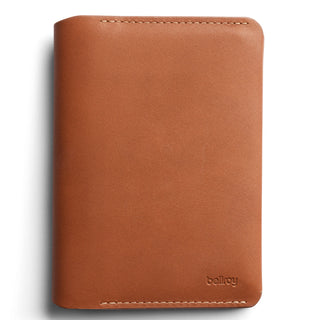 Bellroy Passport Cover in smooth tan leather with subtle stitching and embossed logo on front