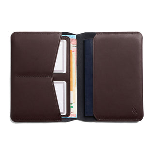 Bellroy Passport Cover open showing smooth dark brown leather with card and passport compartments