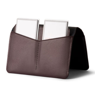 Bellroy Passport Cover in brown leather showing dual card pockets and smooth texture open angle