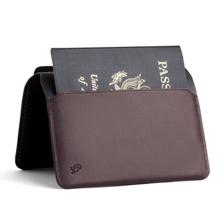 Bellroy Passport Cover in brown leather holding a partially visible US passport vertically
