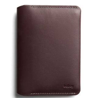 Bellroy Passport Cover in smooth dark brown leather with visible stitching and embossed logo detail