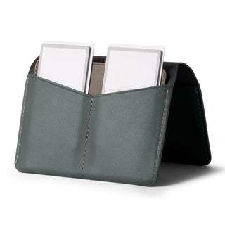 Bellroy Passport Cover in green leather with two card slots and neat stitching detail standing upright