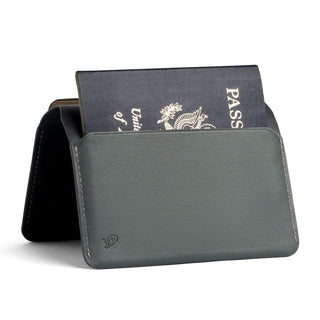 Bellroy Passport Cover in smooth dark leather holding a partially visible passport upright