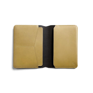 Bellroy Passport Cover in tan leather open to show card slots and smooth interior lining