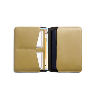 Bellroy Passport Cover in tan leather with multiple card slots and slim design opened flat