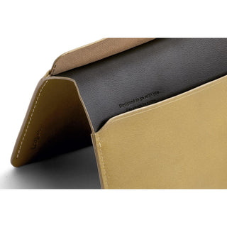Bellroy Passport Cover in tan leather showing folded design and smooth interior lining detail