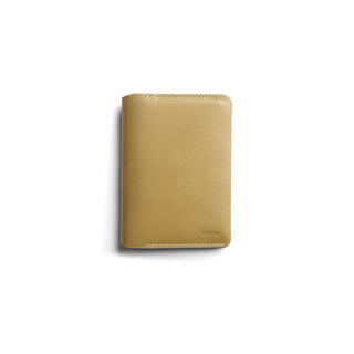 Bellroy Passport Cover in tan leather with smooth texture and subtle embossed logo on front