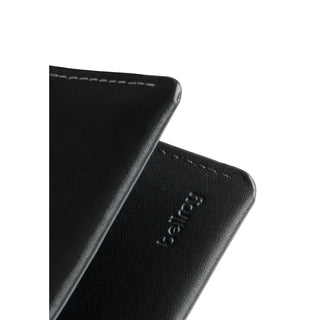 Bellroy Under Cover black leather card sleeve with embossed logo and fine stitching detail close-up