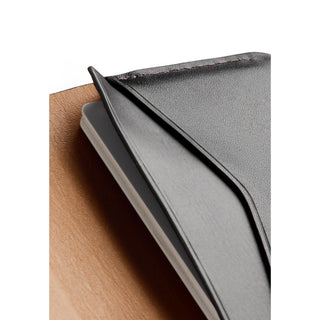 Bellroy Under Cover black leather card sleeve with smooth texture holding cards inside