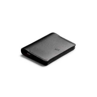 Bellroy Under Cover black leather card sleeve with smooth finish and minimalist design angled view