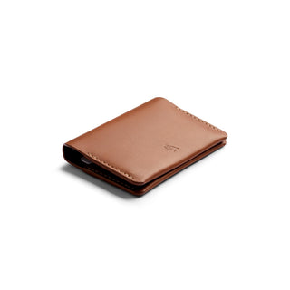 Bellroy Under Cover slim brown leather card holder with fine stitch detail on white background